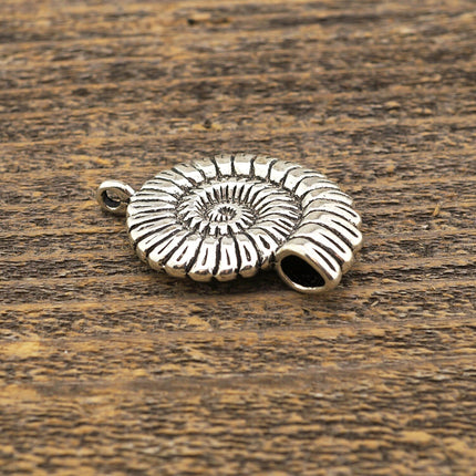 Large shell pendant, antiqued silver plated base metal, spiraling round shape, Irina Miech, 36mm